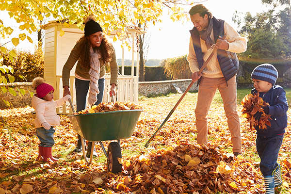 Family Sweeping Leaves